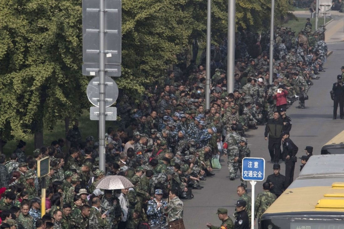 Veterans protest outside the defence ministry in Beijing over military pensions and benefits. Photo: AP