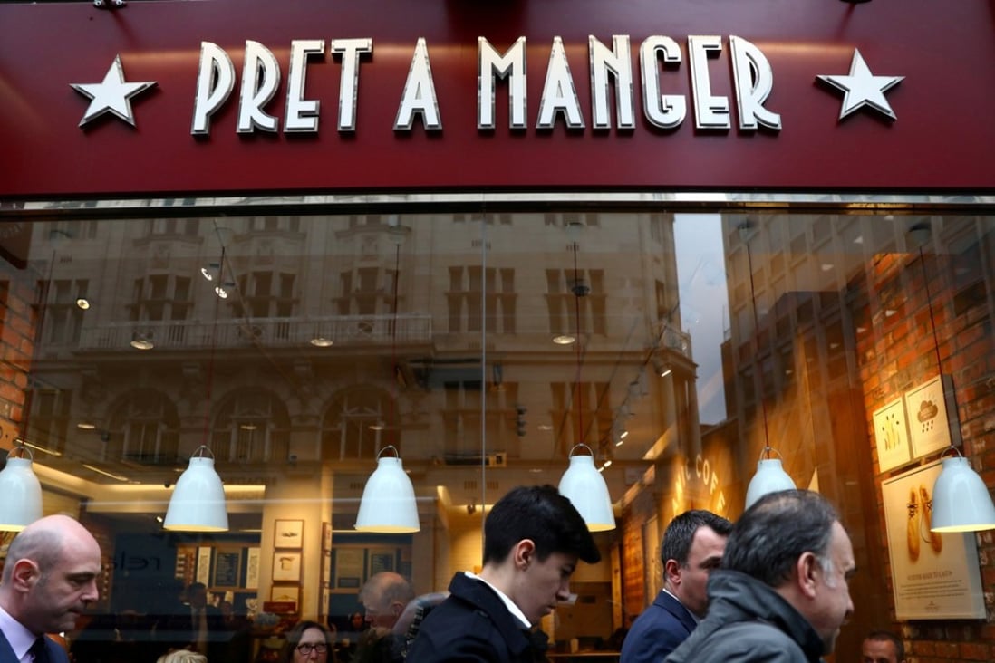 People walk past a Pret A Manger cafe in London. Photo: Reuters