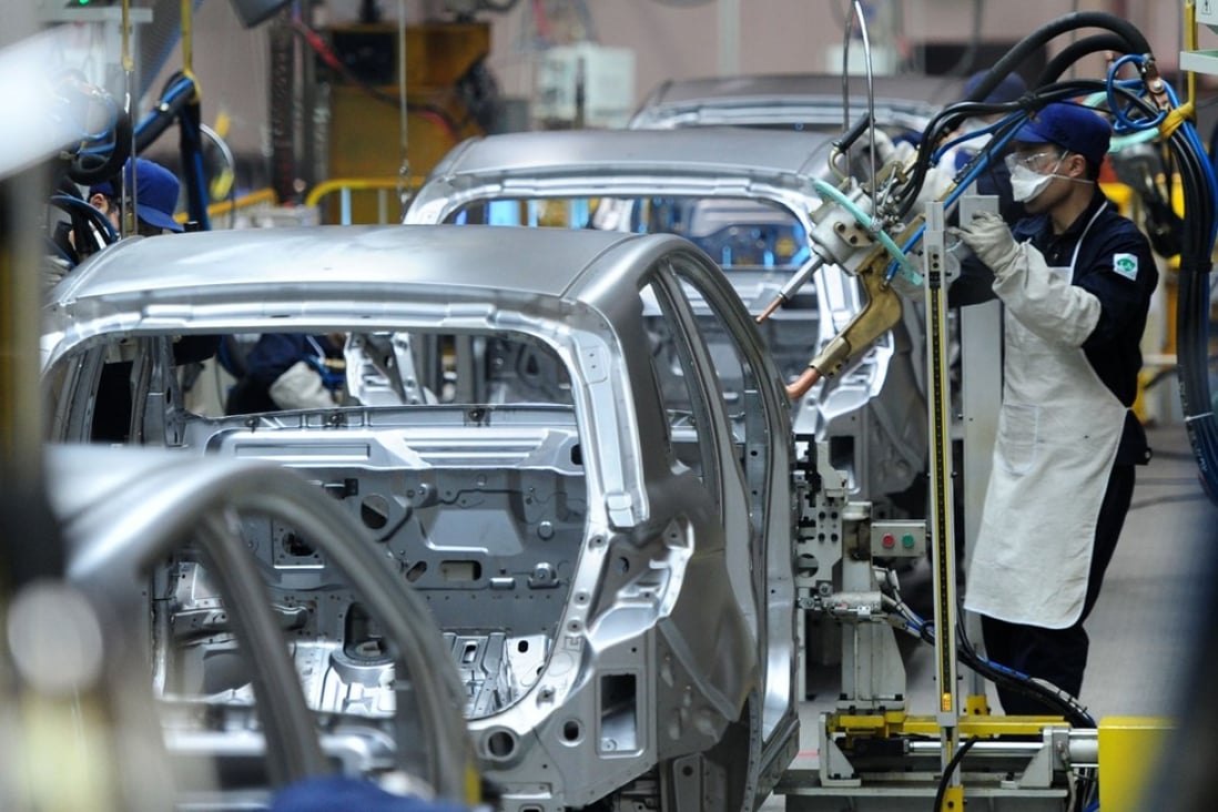 Cars are assembled at BAIC Motor’s plant in Zhuzhou, in Hunan province. On Tuesday, Beijing said it would phase out rules requiring foreign carmakers to partner with a local firm to set up a factory in China in the next five years. Photo: Imaginechina