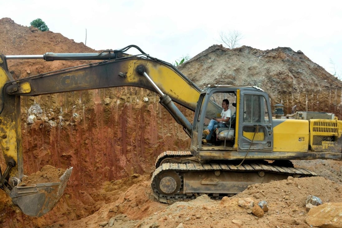 In this photograph taken on April, a Chinese employee of a mining company operates a bulldozer at a mining site in the Cameroon town of Betare Oya. Photo: Agence France-Presse