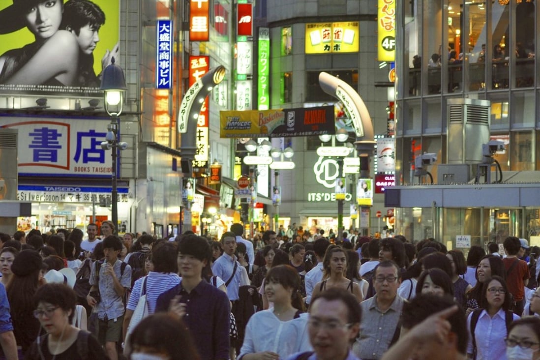 Hundreds of people cross at Shibuya’s famous scramble intersection every time the walk light turns green. Tokyo’s trendy Shibuya ward will permit home-sharing services in residential areas only during school holidays. Photo: Daniel Hurst