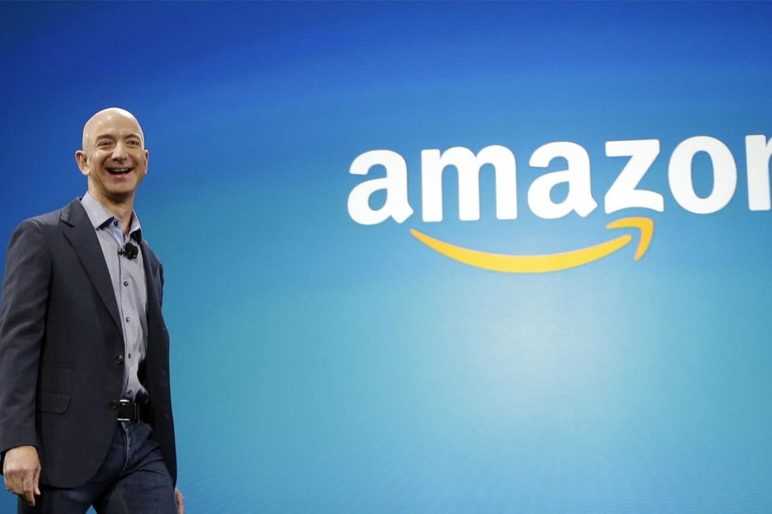 Amazon CEO Jeff Bezos walks onstage for the launch of the new Amazon Fire Phone, in Seattle. Photo: AP