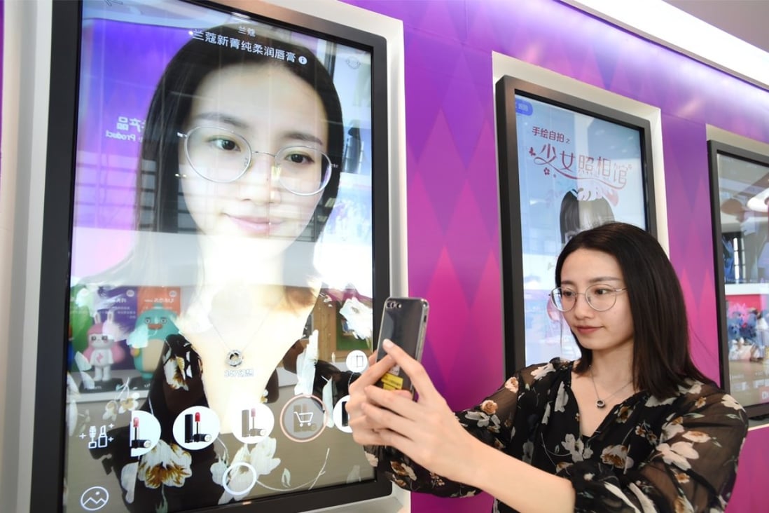 A staff member of Meitu demonstrates the company's software product. Photo: Xinhua