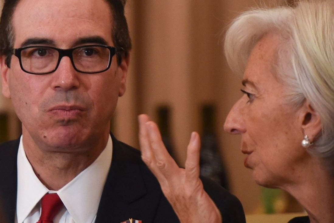 US Treasury Secretary Steven Mnuchin listens to International Monetary Fund managing director Christine Lagarde before a luncheon with French President Emmanuel Macron and US Vice-President Mike Pence, at the US State Department in Washington, on April 24. Photo: AFP