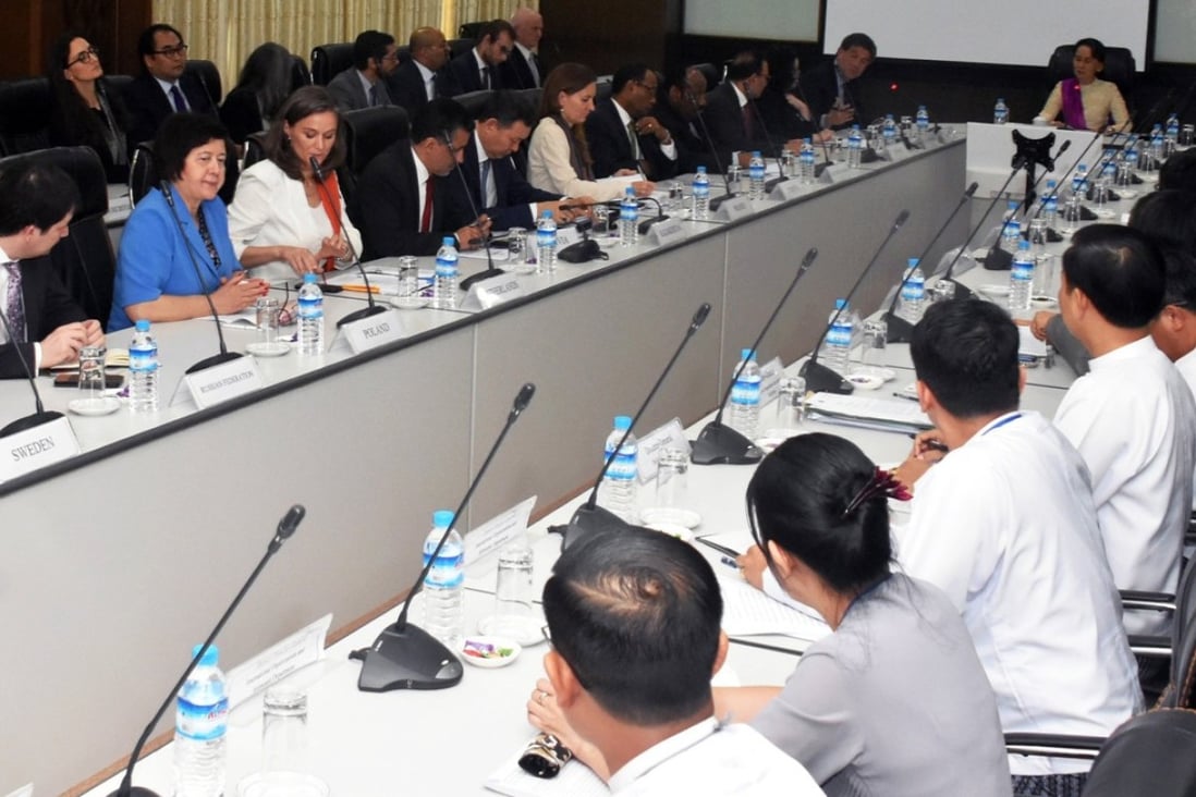 Myanmar's State Counselor Aung San Suu Kyi, center, meets with a UN Security Council team in Naypyidaw, Myanmar, on Monday, in this handout photo made available by the Myanmar’s Ministry of Information (MOI). Photo: EPA-EFE/MOI 