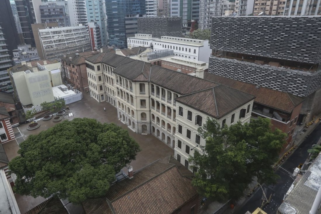 The rear part of the restored Central Police Station compound, now called Tai Kwun Centre for Heritage and Art, showing the two blocks of contemporary design alongside its heritage buildings. A cherished mango tree is in the foreground on the left. Photo: Nora Tam