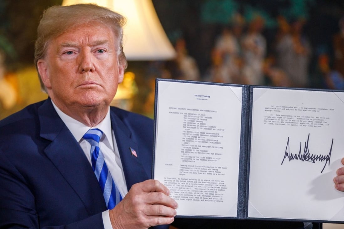 US President Donald Trump signs a memorandum declaring his intention to withdraw from the Iranian nuclear deal. Photo: Xinhua