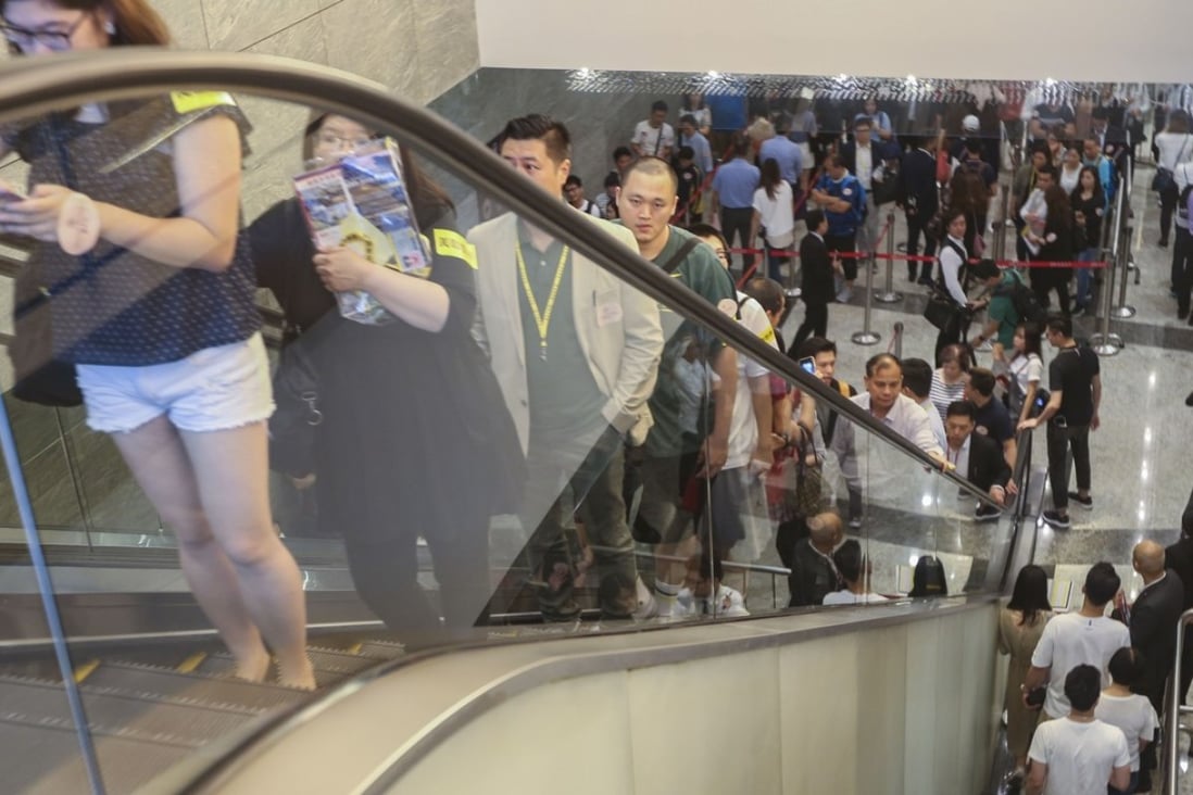 Prospective buyers queuing up as property developer Sun Hung Kai Properties launches its sale at the International Commerce Centre in West Kowloon. Photo: Xiaomei Chen
