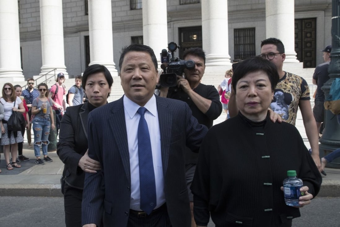 Ng Lap-seng (seen centre on Friday outside New York federal court with his wife), a Macau billionaire real estate developer, has been sentenced to four years in a US prison for bribing UN officials US$1.7 million. Photo: AP