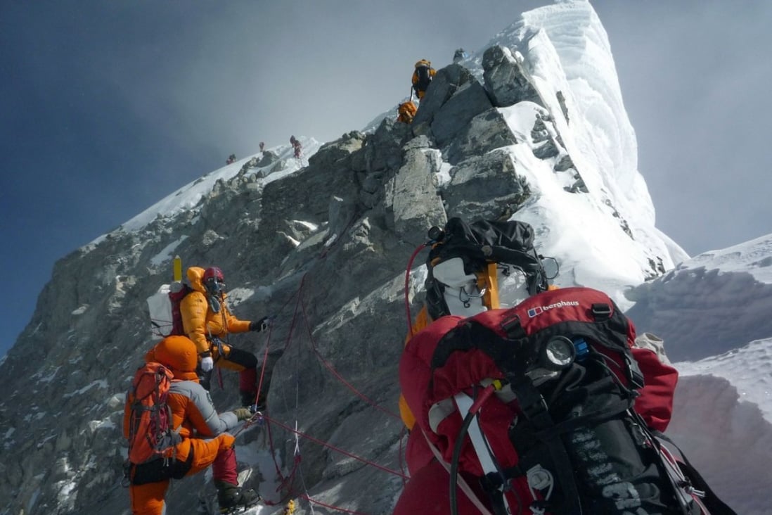 File photo of mountaineers climbing past the Hillary Step while pushing for the summit of Mount Everest. Photo: AFP