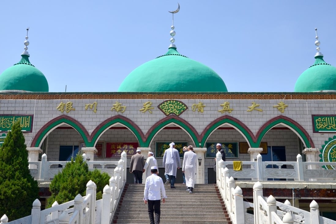 Hui Muslims head towards the prayer hall at the Nanguan Grand Mosque in Yinchuan. Photo: Nectar Gan
