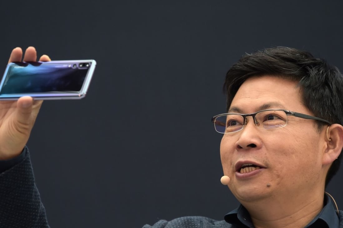 Huawei CEO Richard Yu presents the P20 smartphone in Paris on March 27, 2018. Photo: AFP