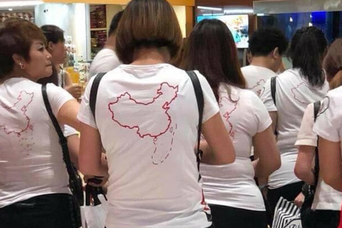Chinese tourists in Vietnam with T-shirts depicting Beijing’s claims to the South China Sea. File photo