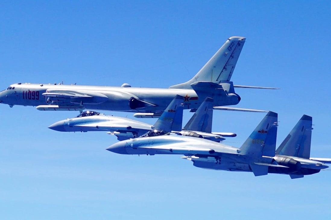 A Chinese H-6K strategic bomber, like the one shown here accompanied by two Su-35 fighter jets, recently took part in landing exercises on an island reef in the South China Sea, according to the PLA Air Force. Photo: Xinhua