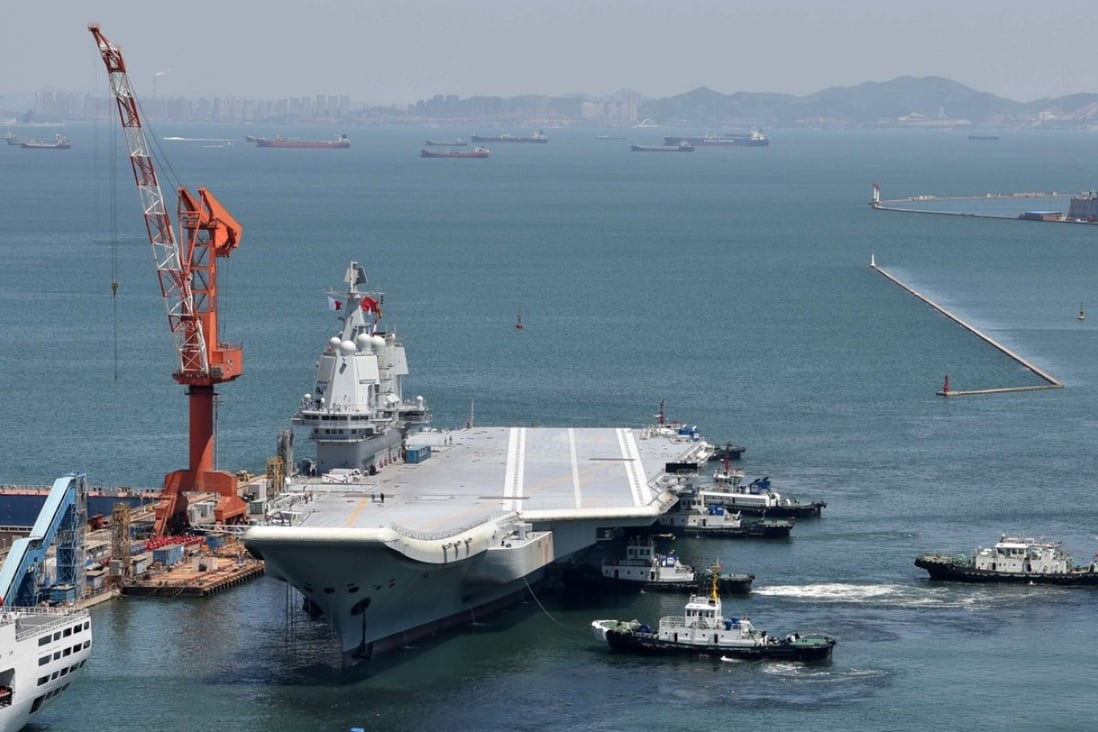 The Type 001 aircraft carrier returns to port in Dalian. Photo: Reuters