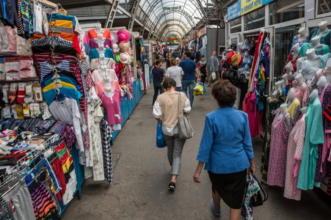 Shoppers walk past stalls near the Green Bazaar in Almaty, Kazakhstan, in April. An agreement between China and the Eurasian Economic Union will give Chinese companies an edge over their EU competitors in Central Asia. Photo: Bloomberg