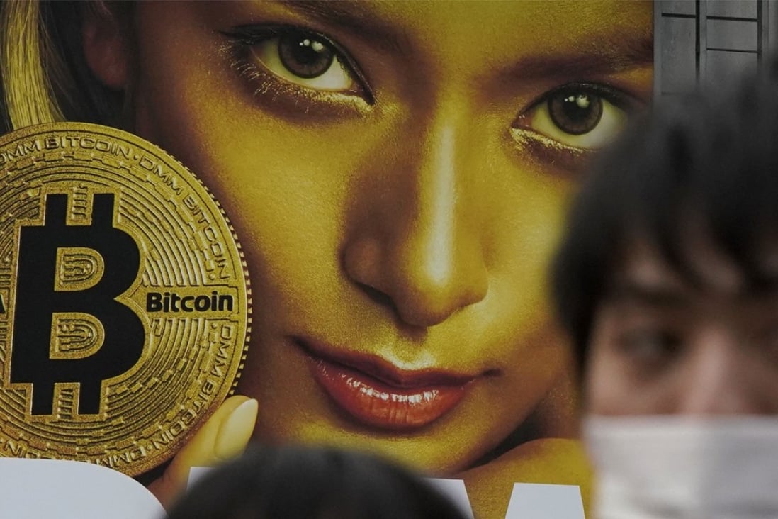 A huge advertisement of bitcoin is displayed near Shibuya train station in Tokyo.  Photo: AP