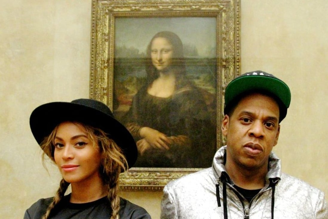 Beyoncé and Jay Z at the Louvre in Paris snapped in front of the Mona Lisa. Photo: Beyonce.com