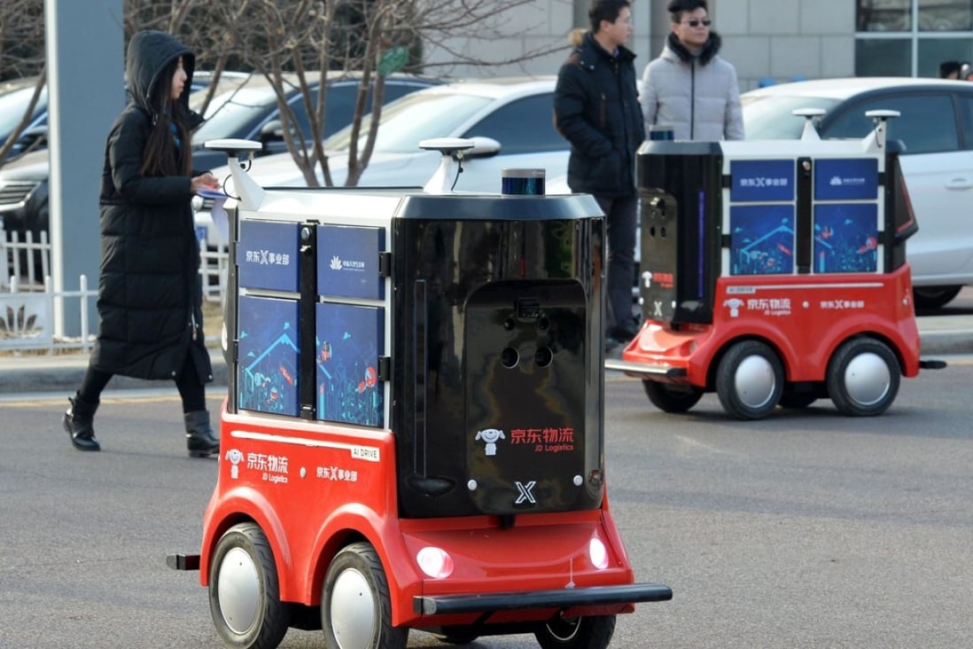 In January JD.com demonstrated these driverless delivery vehicles in the northern Chinese city of Tianjin. It is now moving to introduce unmanned trucks to improve efficiency in logistics operations. Photo: AFP