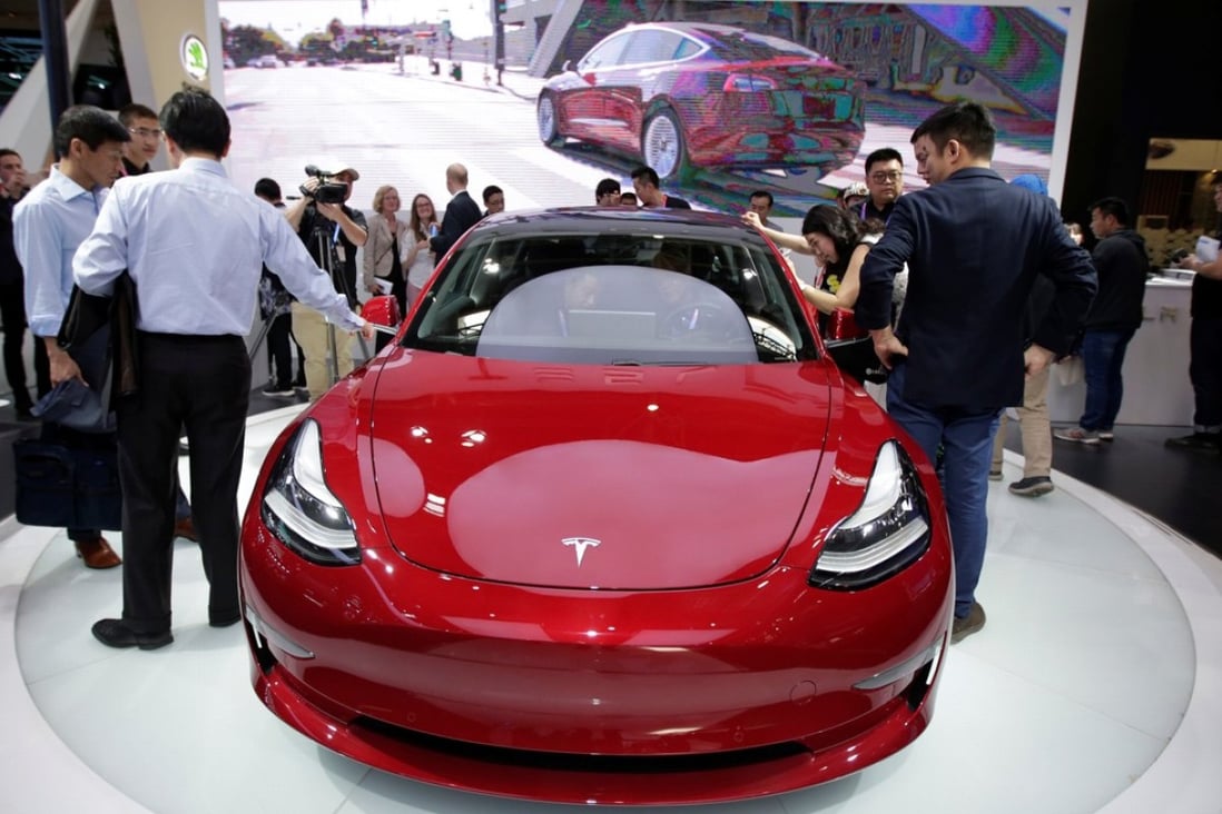 A Tesla Model 3 car is displayed during a media preview at the Auto China 2018 motor show in Beijing in April this year. The world’s fleet of electric vehicles is likely to more than triple to 13 million by the end of this decade, up from 3.7 million units last year, according to the International Energy Agency. Photo: Reuters