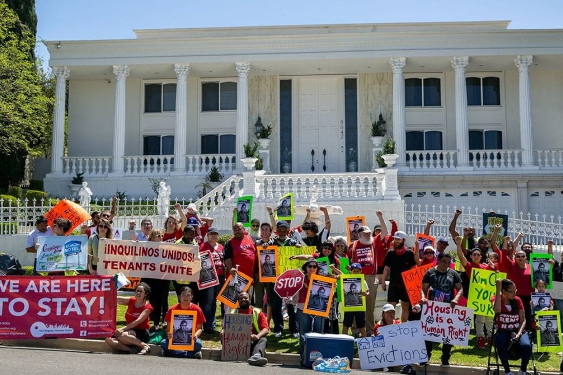 Renters who received eviction notices at their flat units in South Los Angeles gathered for a demonstration at the Orange County mansion of their new landlord. Photo: Los Angeles Tenants Union