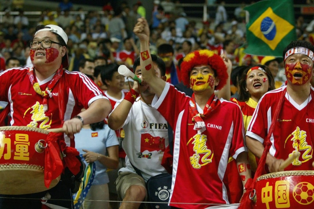 Fans cheer during China’s World Cup game against Brazil on June 8, 2002 at the Jeju Stadium in Seogwipo, South Korea. Photo: AFP