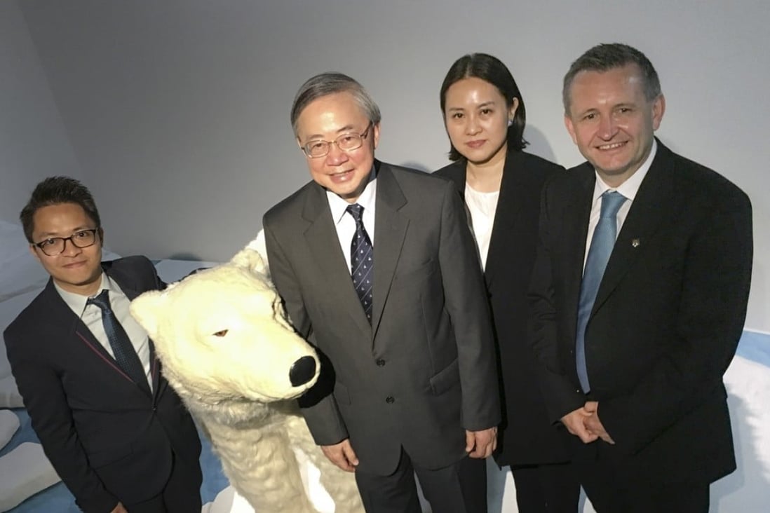 Amos Tai (far left), assistant professor at Chinese University’s Earth System Science Programme, Gabriel Lau, co-director of the new CUHK – University of Exeter Joint Centre for Environmental Sustainability and Resilience (Ensure), Professor Emily Chan, assistant dean (development) at CUHK Faculty of Medicine, and Gavin Shaddick, co-director of Ensure, pose next to a mock polar bear at the Jockey Club Museum of Climate Change, at Chinese University, Sha Tin. Photo: Handout