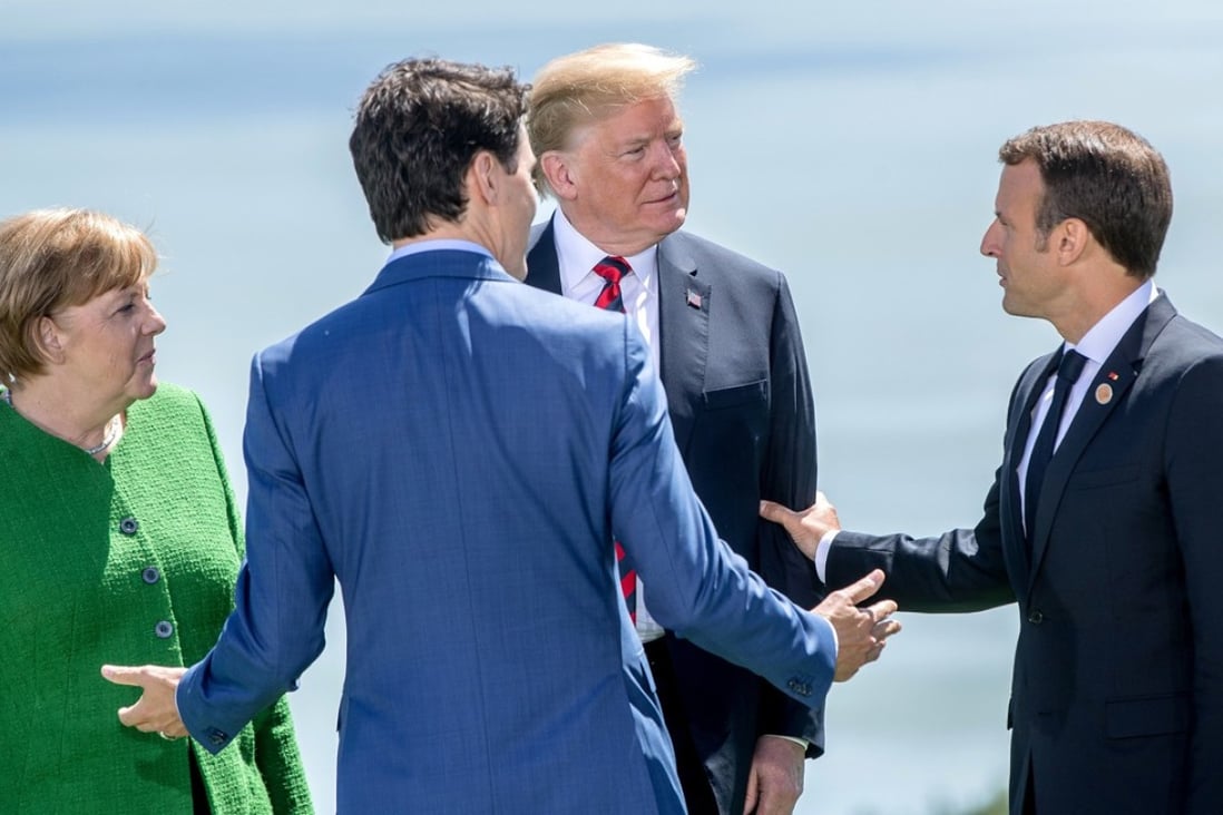 US President Donald Trump with German Chancellor Angela Merkel, Canadian Prime Minister Justin Trudeau and French President Emmanuel Macron. Photo: TNS