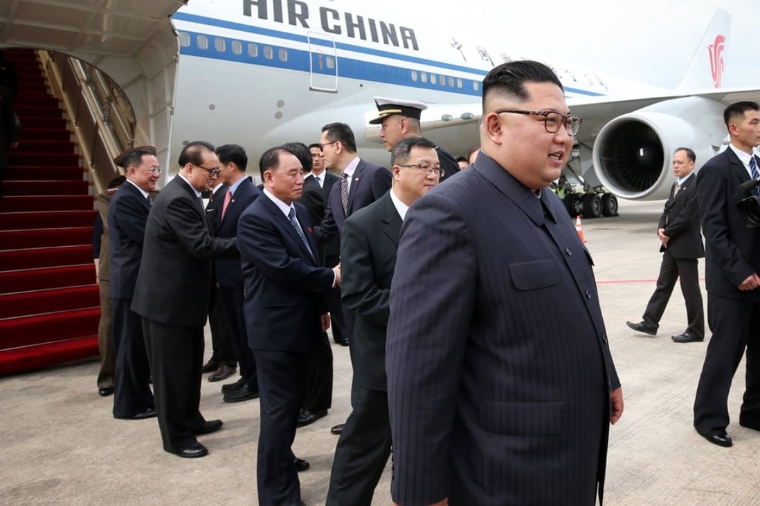 North Korean leader Kim Jong-un steps off an Air China Boeing 747 in Singapore on Sunday. Photo: AFP