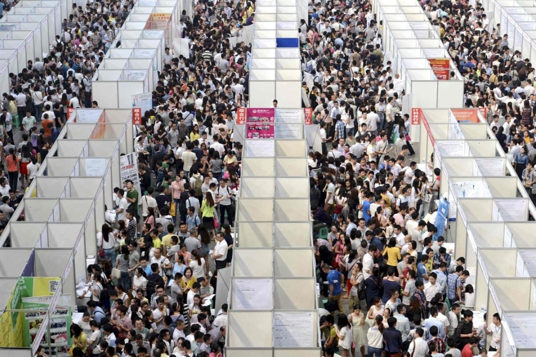 Thousands of job seekers visit booths at a job fair in Chongqing, China. Photo: Reuters