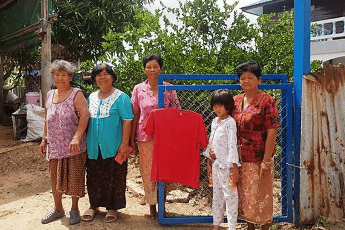 A red shirt is hung in front of a family's house to prevent what they call 'widow ghost' from visiting. Photo: Prasit Tangprasert/ Bangkok Post