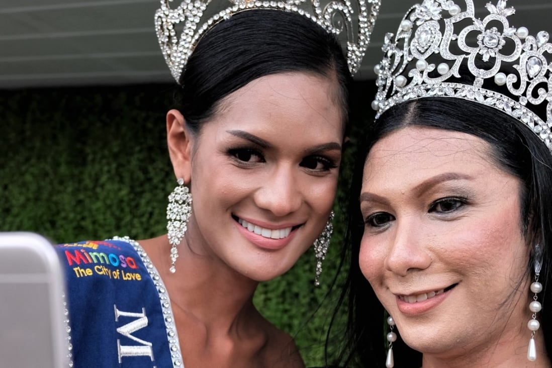 Asan Sohoh (left) and Ardulmalik Maskul, two transgender women from Muslim majority southern Thailand take a selfie. Photo: Tibor Krausz