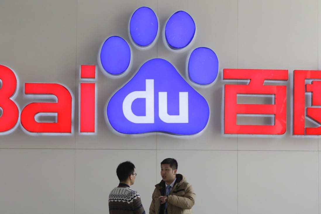 People talk in front of a Baidu's company logo at Baidu's headquarters in Beijing in this file photo taken January 16, 2014. China's biggest internet search company blew past Wall Street's targets with a 34.1 percent jump in quarterly net profit, helped by a surge in mobile revenue. Photo: Reuters