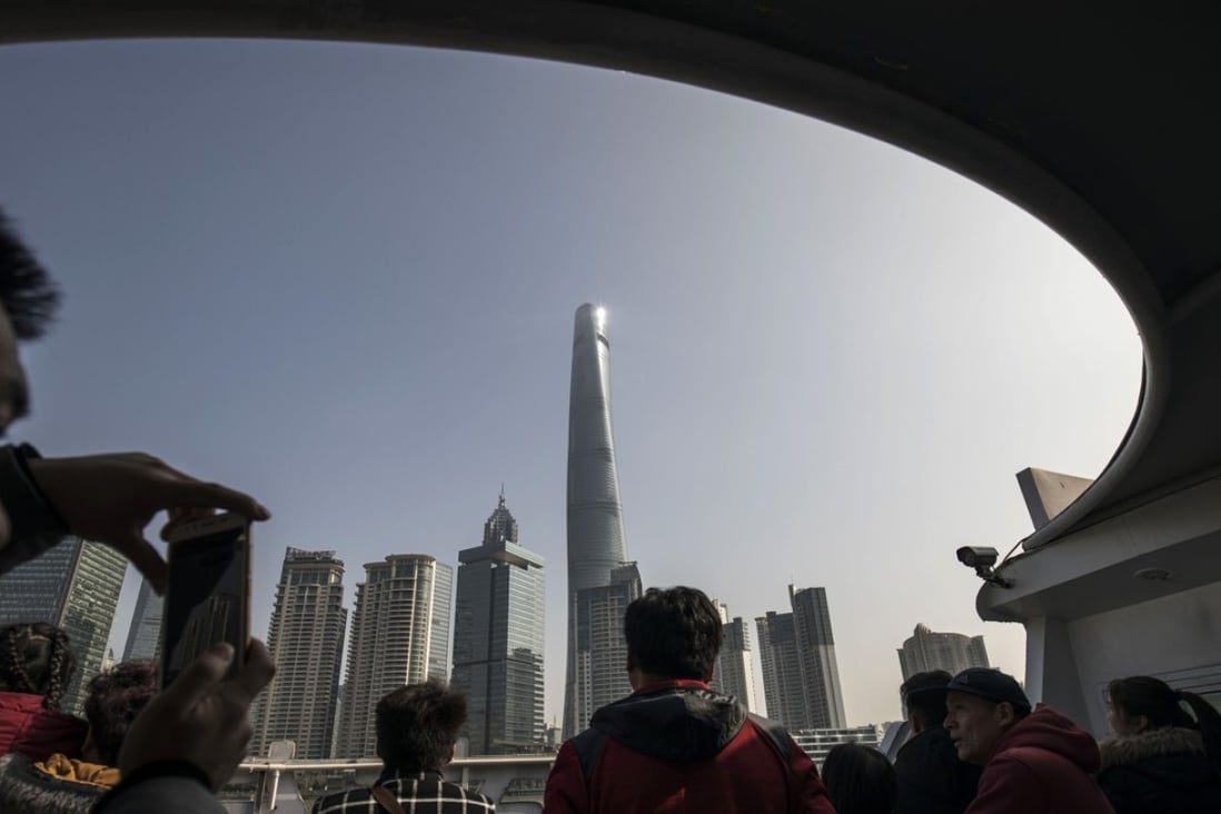 Tourists on a ferry crossing the Huangpu River as the Shanghai Tower and other buildings stand in the Lujiazui Financial District in Shanghai on February 26, 2018. The issuance of Chinese depositary receipts (CDRs) is hailed as an innovation to mark the 40th anniversary of China’s financial reforms, as a way to allow local investors to partake in the success and earnings of its biggest offshore-listed companies. Photo: Qilai Shen/Bloomberg