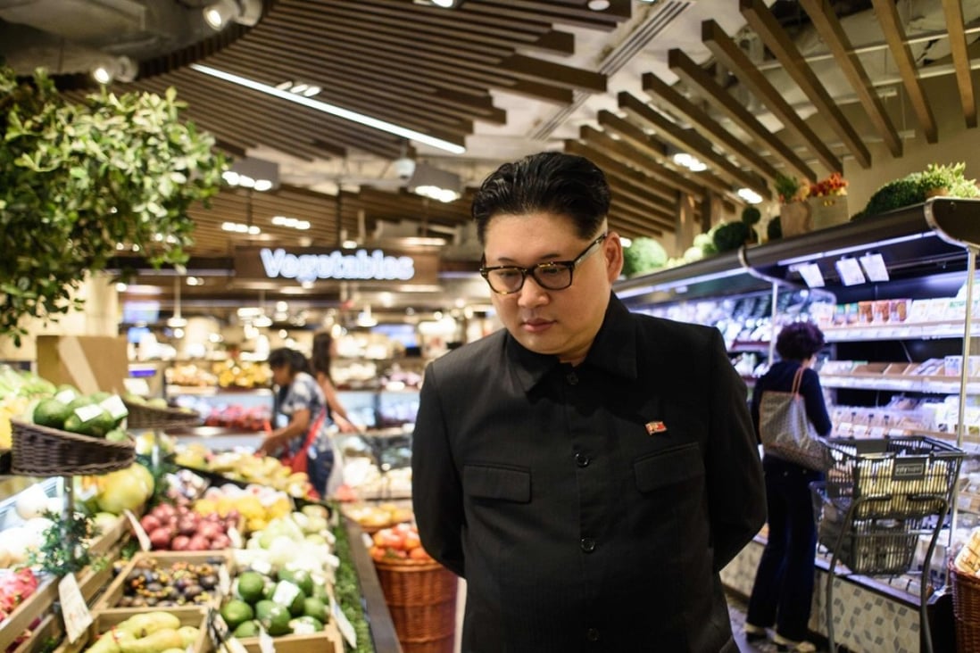 Kim Jong-un impersonator Howard X in a supermarket in Hong Kong. Photo: Anthony Wallace