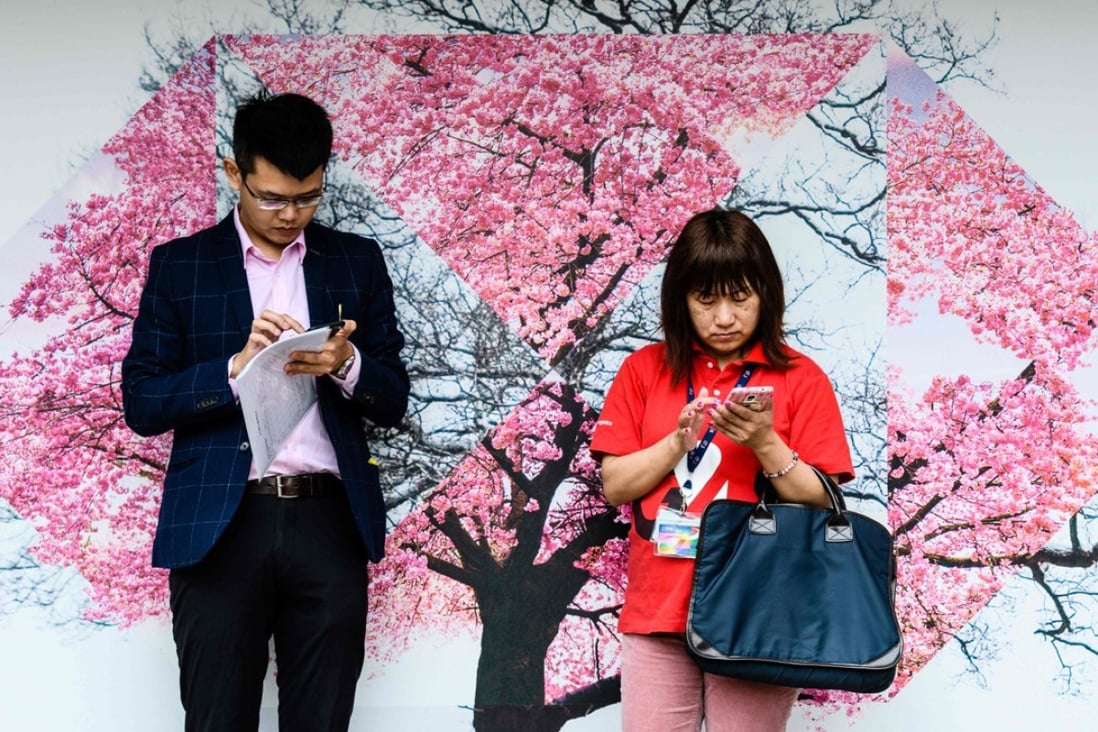 Hong Kong has one of the world’s highest mobile phone usage rates at 248 per cent, according to government data released in February. Photo: AFP