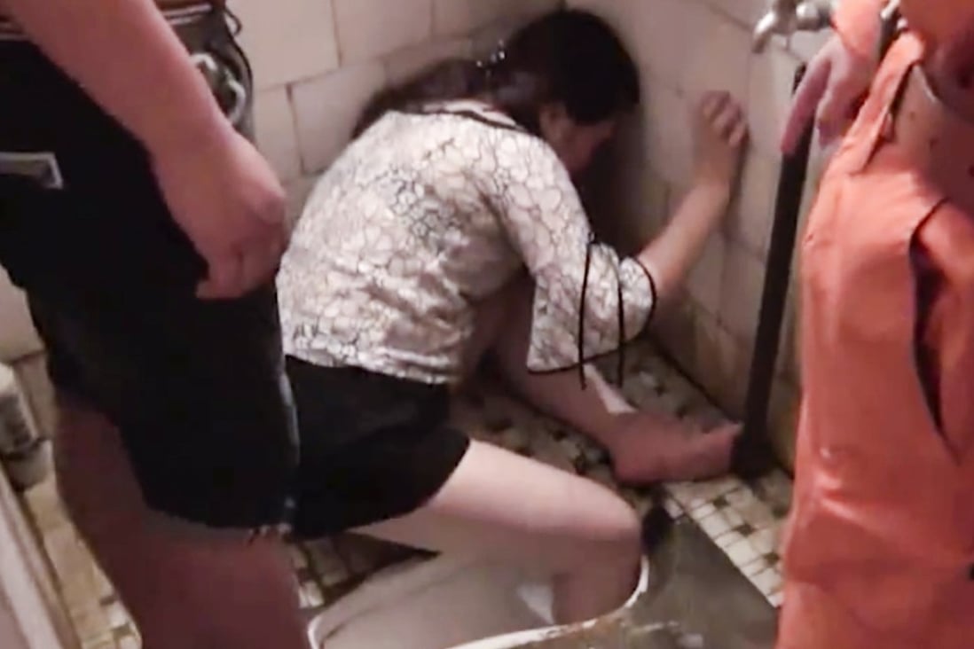 A drunk woman in Yulin, Guangxi, had to be rescued by firefighters after she slipped and got her leg stuck in a squat toilet. Photo: pearvideo.com