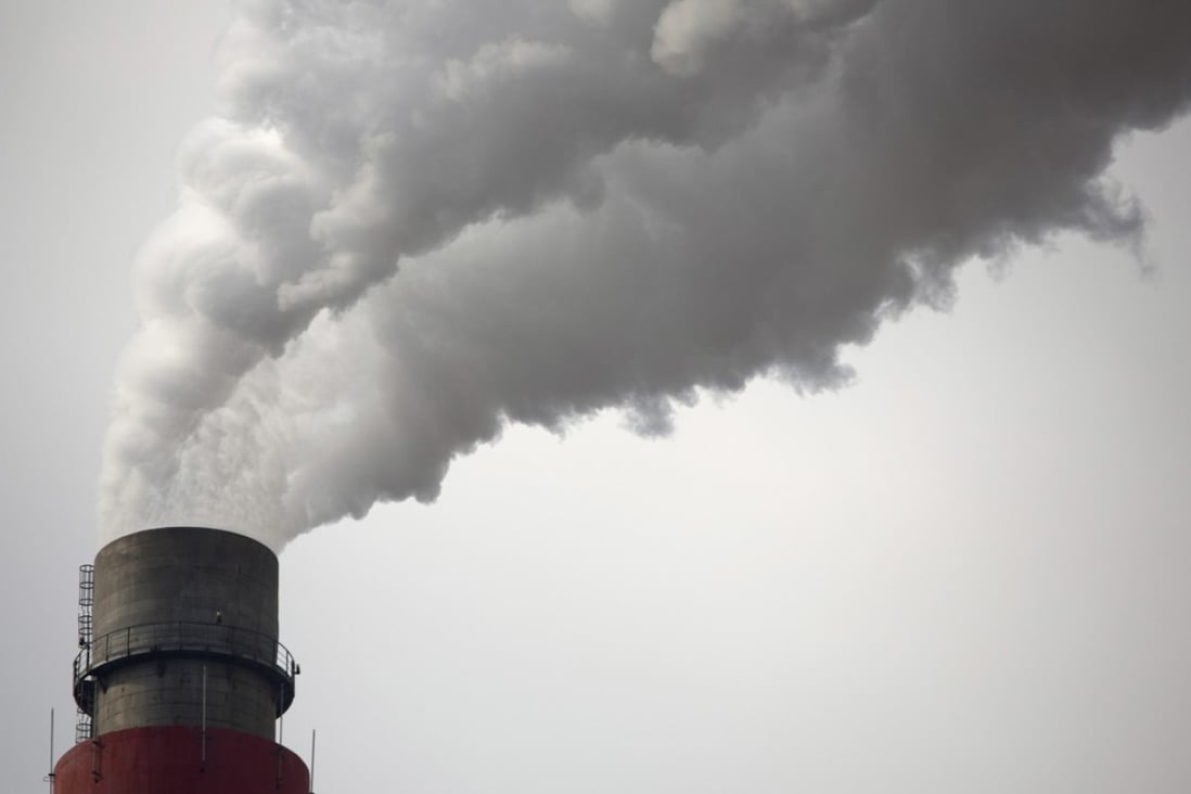 Smoke and steam rise from the smokestack of a coal-fired power plant in northern China. According to a new study by American researchers, sulphur dioxide emissions at 256 coal-fired plants in China have dropped by nearly 14 per cent in response to a new anti-pollution law. Photo: AP