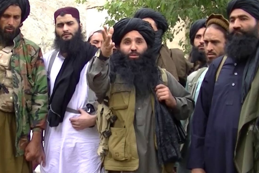 Mullah Fazlullah (centre) in 2014. Photo: EPA