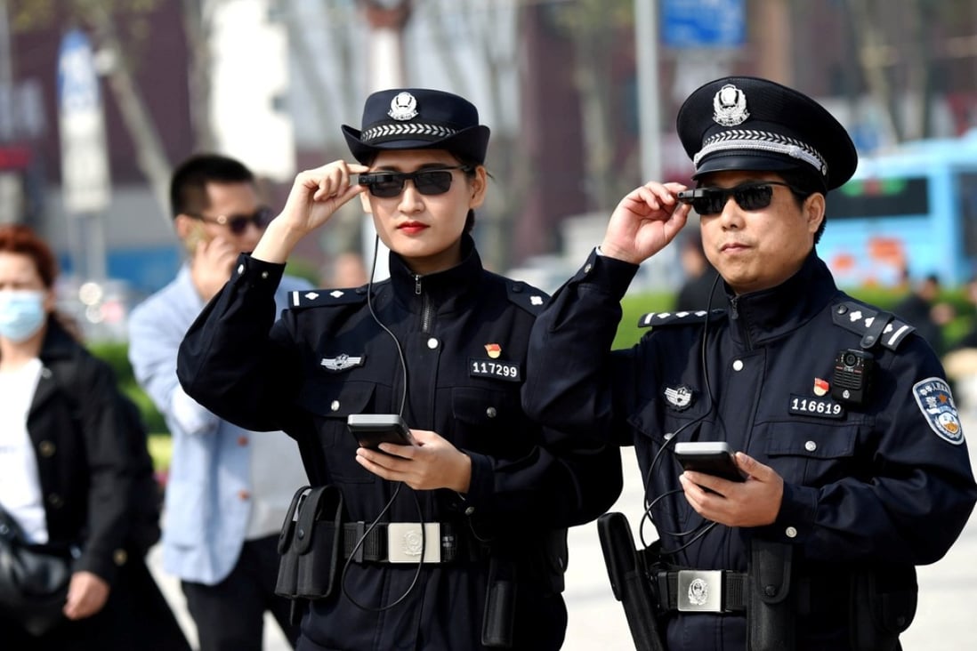 Police officers display their AI-powered smart glasses in Luoyang, Henan province, China. Photo: Reuters