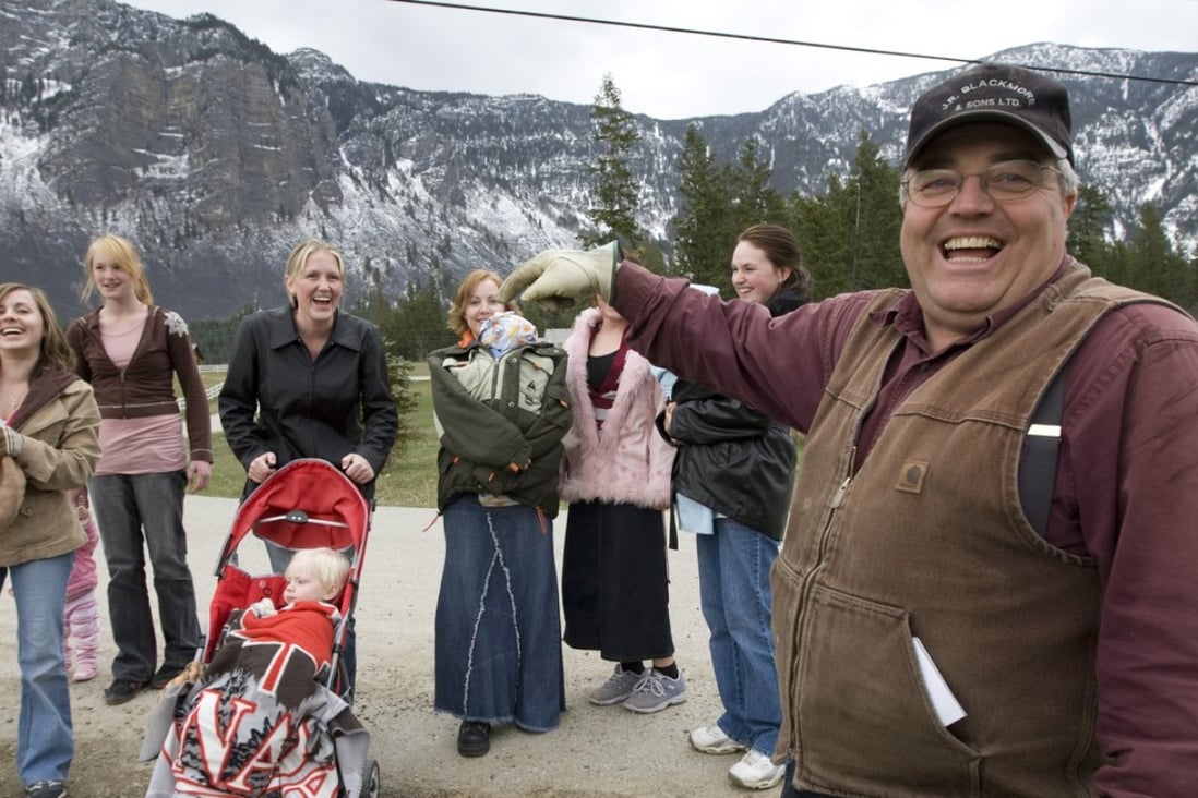 A 2008 photograph of Winston Blackmore, the religious leader of the Canadian polygamous community of Bountiful located near Creston, British Columbia, with six of his daughters and some of his grandchildren. On Tuesday, Blackmore was sentenced to six months house arrest. Photo: Canadian Press via AP