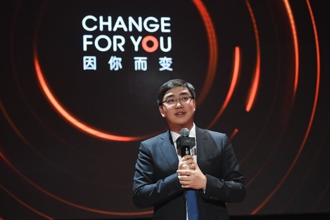Cheng Wei, founder and CEO of Didi Chuxing, unveils the rebranding and service upgrades to Didi Premier in Beijing on Friday. Photo: Handout