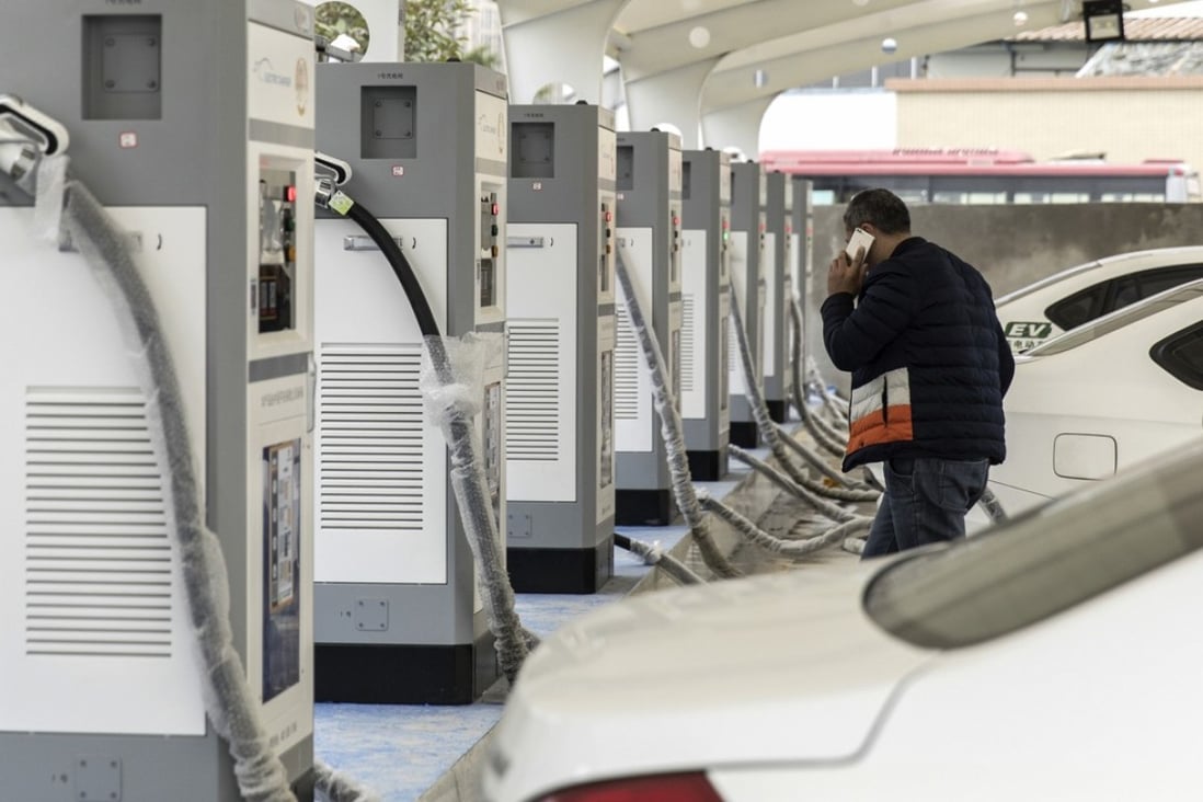 Electric taxis stand at a charging station operated by an electric vehicle showroom in Ningde in Fujian Province on Monday, January 29, 2018. China surpassed the US in 2015 to become the world's biggest market for electric cars. Sales of new-energy vehicles - including battery-powered, plug-in hybrid and fuel-cell vehicles - reached 777,000 units last year and could surpass 1 million this year, the China Association of Automobile Manufacturers estimated. Photo: Qilai Shen/Bloomberg
