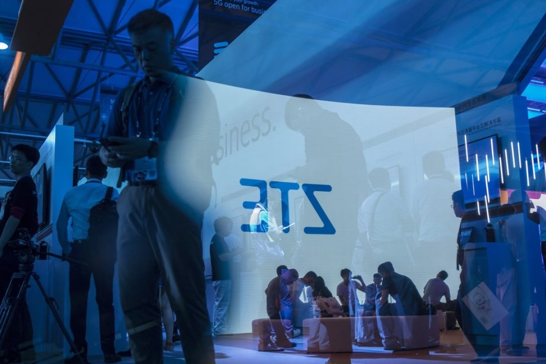 The ZTE logo projected on a screen is reflected on a pane of glass at the Ericsson AB booth at the Mobile World Congress Shanghai on June 28, 2018. Photo: Bloomberg