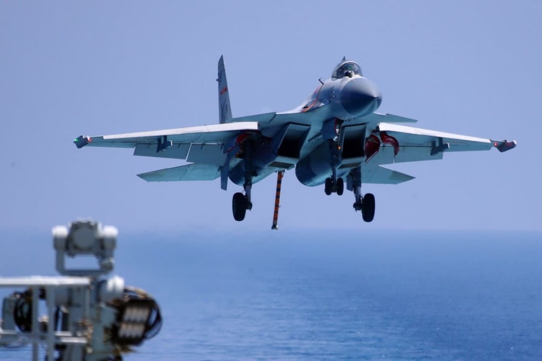A J-15 prepares to land on China’s only operational aircraft carrier, the Liaoning, during a drill in April. Photo: AFP