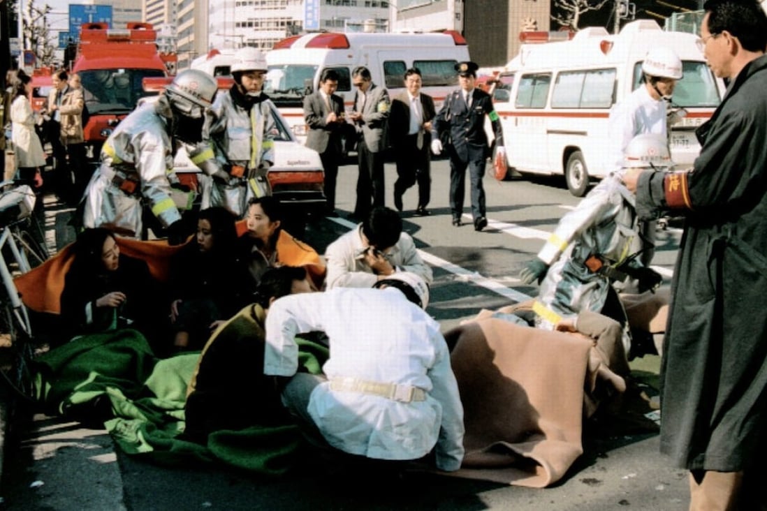 Patients receive treatment in front of Tsukiji Station, in Tokyo, on March 20, 1995, after a sarin gas attack by the Aum Shinrikyo cult. Picture: Kyodo