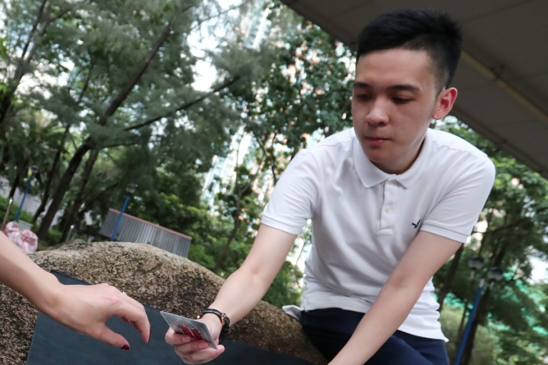 Horoscope and card reader Alanstair Lau Siu-yu, 26, in Tsuen Wan West. Photo: Jonathan Wong