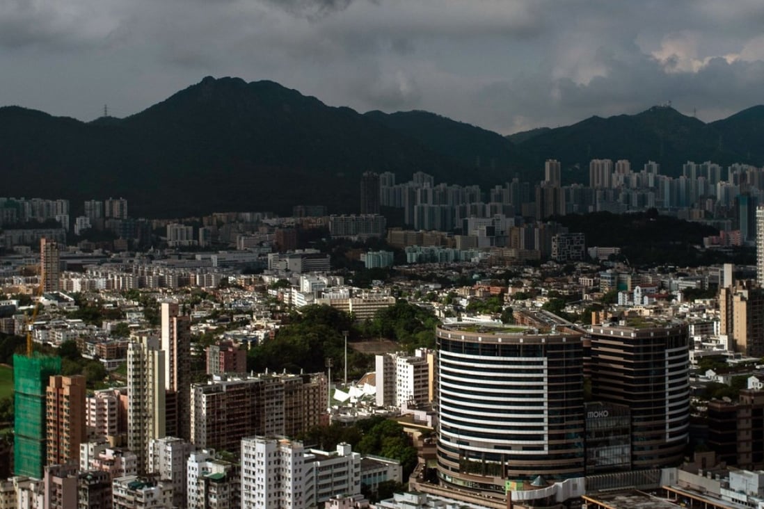 Looking out over Kowloon. In Hong Kong buying a government subsidised home under the Home Ownership Scheme (HOS) is the equivalent of winning the lottery. Photo: AFP