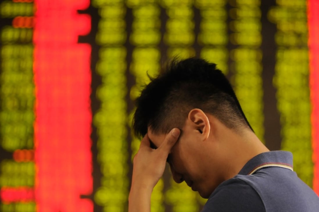 A man appears dejected at a stock exchange in Xingtai, in north China’s Hebei province, on June 19. Chinese stocks have had a rough run over the past two weeks, amid the US-China trade tensions. Photo: Xinhua