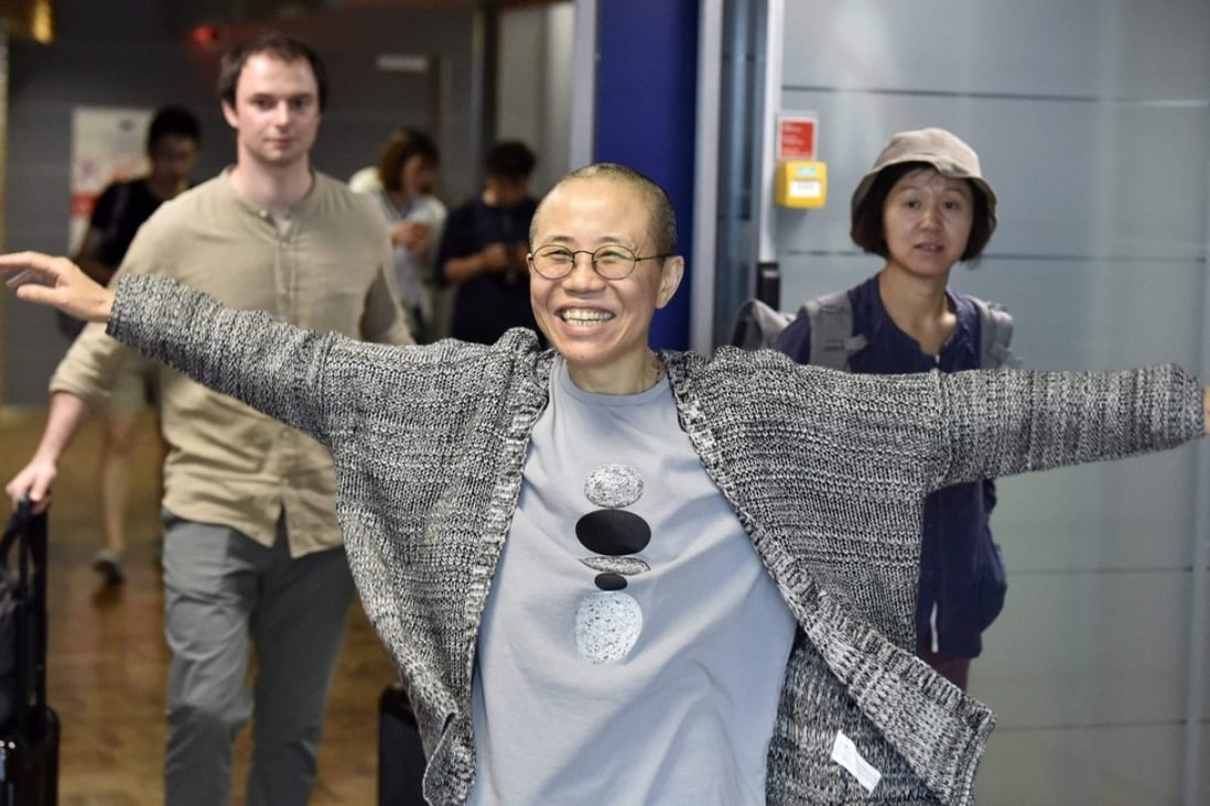 Liu Xia, the widow of Nobel laureate Liu Xiaobo, is all smiles as she arrives at Helsinki Airport in Finland on Tuesday. Photo: AFP